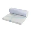 A mattress topper is shown rolled up and partially unrolled on a white background. Podgląd zdjęcia produktu