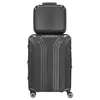 A dark gray cosmetic case is stacked on top of a larger dark gray suitcase, both against a white background. Anteprima dell’immagine prodotto