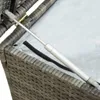 Close-up of a gas strut mechanism on a grey rattan storage box. Produktbild-Vorschau