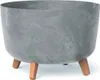 A gray planter pot with three brown legs, shown against a white background. Náhled obrázku produktu