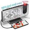 A digital alarm clock with a projection feature, charging a smartphone, with graphics indicating radio waves and temperature/humidity readings. Produktbild-Vorschau