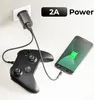A smartphone and a game controller are shown connected to a charger plugged into a wall socket. Produktbild-Vorschau