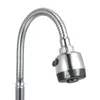 A close-up shot of a modern kitchen faucet with a flexible hose and a spray head. Podgląd zdjęcia produktu