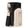 A baby bottle warmer and its carrying case are shown against a white background. Produktbild-Vorschau