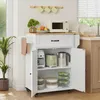 A white kitchen cart with a wooden countertop, filled with kitchen appliances and storage containers. It is placed in a kitchen setting next to a window. Podgląd zdjęcia produktu