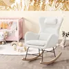 A white rocking chair is placed in a nursery next to a pink crib. Produktbild-Vorschau