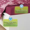 A close-up of a bed with a purple duvet cover and a pink and white patterned blanket. Produktbild-Vorschau