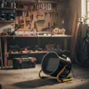 A workshop scene with tools, a workbench, and a heater. Voir les images du produit