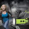 A woman running from a tornado, holding a flashlight, with a survival radio in the foreground. Produktbild-Vorschau