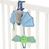 A baby crib toy hanging from the railing of a crib. Produktbild-Vorschau