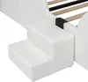 A close-up view of the steps of a white upholstered bed frame. Produktbild-Vorschau