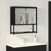 A black bathroom cabinet with mirrored doors and a shelf is mounted on a tiled wall above a sink. Produktbild-Vorschau