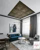 A modern living room with a blue sofa, armchair, coffee table, and a decorative ceiling. Produktbild-Vorschau