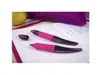 Two pink and black pens are placed on an open notebook, with a purple pencil case and an apple in the background. Anteprima dell’immagine prodotto