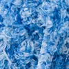 A close-up view of blue and white fluffy yarn. Náhled obrázku produktu
