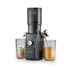 A slow juicer is shown in operation, with juice being dispensed into a glass and pulp in another container. Náhled obrázku produktu