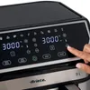 A close-up of an air fryer's digital control panel with a hand interacting with it. Podgląd zdjęcia produktu