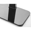 A close-up view of the base of a black TV stand, showing the glossy black surface and a portion of the black support column. Voir les images du produit
