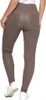 A person wearing beige leggings and white sneakers, shown from the back. Produktbild-Vorschau