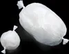 Two white plastic bags filled with contents are shown against a black background. One bag is significantly larger than the other. Produktbild-Vorschau