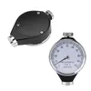 Two durometers are shown against a white background. One is a close-up of a dial gauge, and the other is a side view of a black device with a silver dial. Voir les images du produit