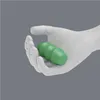 A white mannequin hand holding a green, segmented object. Produktbild-Vorschau