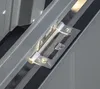A close-up of a metal hinge on a gray outdoor storage box. Podgląd zdjęcia produktu