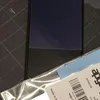 A close-up view of a phone screen protector and its packaging. Produktbild-Vorschau