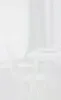 A white kitchen unit with a chair in front of it, set against a window with white curtains. Produktbild-Vorschau