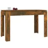A wooden table with a cup and two apples on top. Produktbild-Vorschau