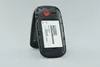 The back of an open flip phone with the battery removed, showing the battery compartment and a battery. Anteprima dell’immagine prodotto