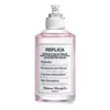 A bottle of Maison Margiela Replica Springtime in a Park Eau de Toilette. Produktbild-Vorschau