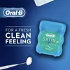 An advertisement for Oral-B Satin Floss, featuring the product and promotional text. Produktbild-Vorschau