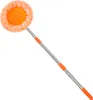 A cleaning mop with an orange fluffy head and a silver extendable handle with orange grips, isolated on a white background. Náhled obrázku produktu