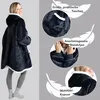 A woman wearing a dark blue hoodie blanket, with close-up shots highlighting its features. Produktbild-Vorschau