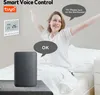 A person is waking up in bed and using a smart speaker to control a thermostat. Náhled obrázku produktu