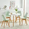 A dining set with a round table and four chairs in a room. Náhled obrázku produktu