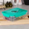 A vacuum food container filled with grapes sits on a wooden cutting board on a kitchen counter. Produktbild-Vorschau