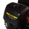 A close-up of a black engine cover with a yellow warning sticker. Produktbild-Vorschau