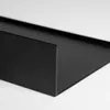 A close-up, angled view of a black metal shelf against a white background. Náhľad obrázku produktu