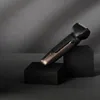 A Remington hair clipper and beard trimmer is displayed on black cubes against a dark gray background. Produktbild-Vorschau