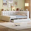 A white corner daybed with storage drawers is shown in a bedroom setting, with artwork and decorative items on the shelf above. Náhled obrázku produktu