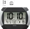 A digital clock displaying the time, date, day of the week, moon phase, and temperature, with icons indicating temperature range and time format. Anteprima dell’immagine prodotto
