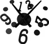 A black wall clock with numbers and hands on a white background. Náhled obrázku produktu