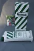 A box and a pouch of Proraso shaving cream are displayed on a gray surface, with a small framed image of a man in the background. Podgląd zdjęcia produktu
