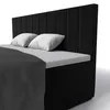 A black boxspring bed with white pillows and a dark gray blanket, shown from a side angle against a white background. Produktbild-Vorschau