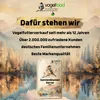 A bag of birdseed is displayed in front of a scenic mountain and lake background, with promotional text about the brand. Produktbild-Vorschau