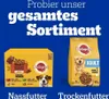 A marketing image showing two Pedigree dog food products against a blue background, with promotional text at the top and labels for wet and dry food at the bottom. Produktbild-Vorschau