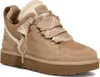 A single beige UGG sneaker with a plaid ribbon detail is shown against a white background. Náhľad obrázku produktu