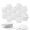A stack of white hexagonal acoustic panels and a larger arrangement of the same panels on a white background. Produktbild-Vorschau